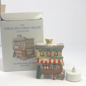 Porcelain Candle Holder, takes the shape of The Hardware Store with a Christmas